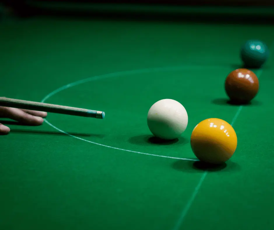 image of a snooker table with three balls -placed in line - snooker and mindfulness